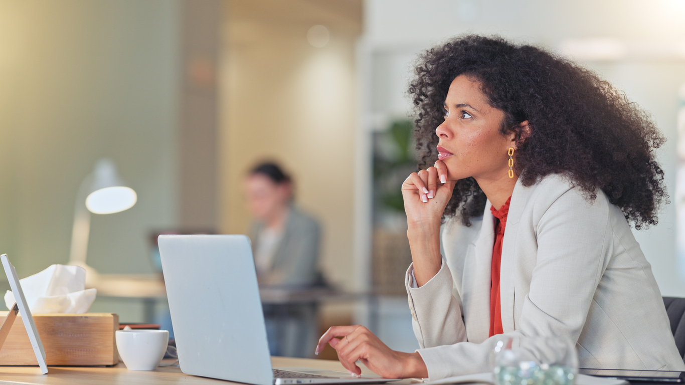 Grant manager deciding between a purpose-built and custom-built grant management system