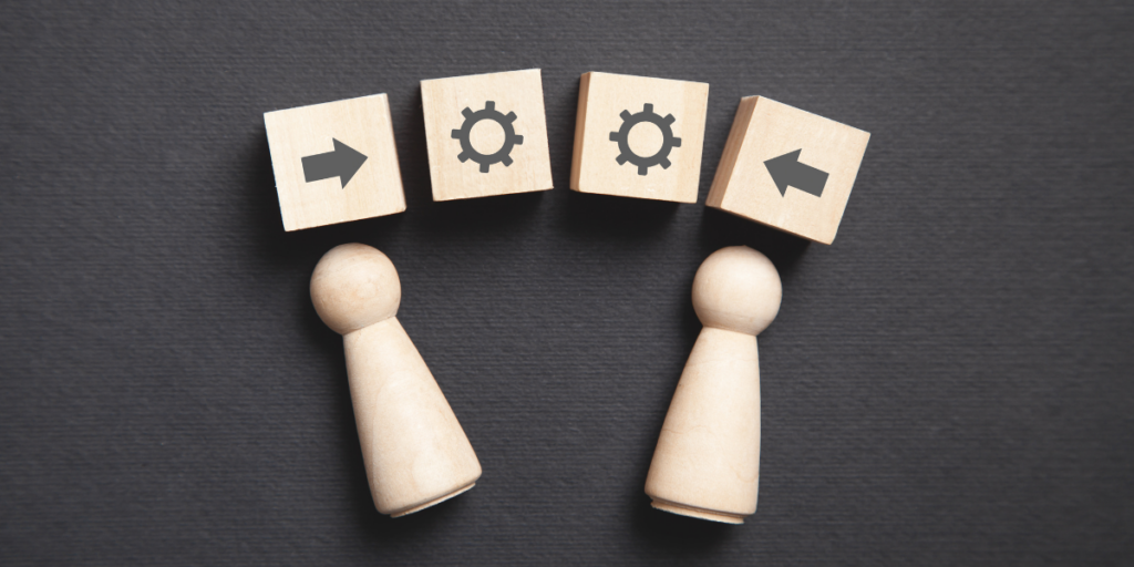 wooden blocks and characters to represent grant management knowledge transfer