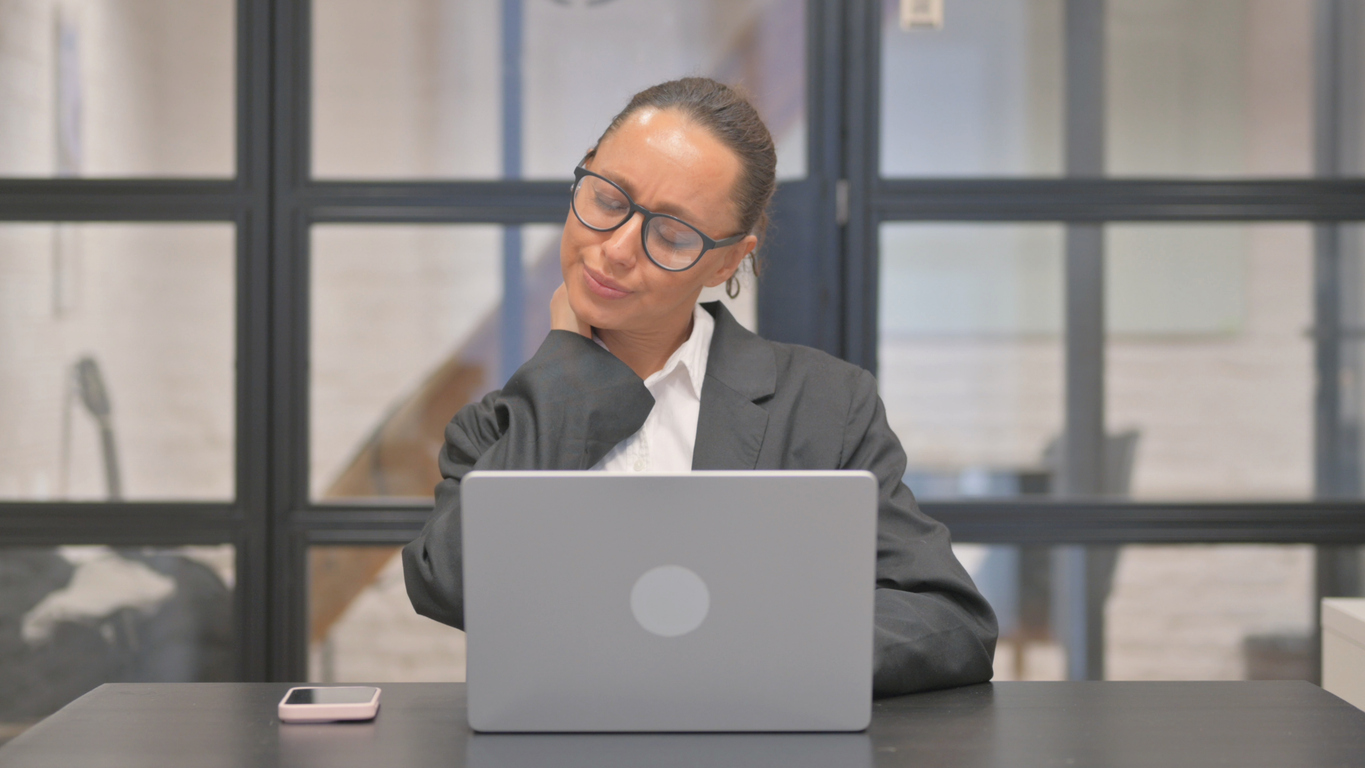 A grant manager working at her desk on common challenges faced in state grant management