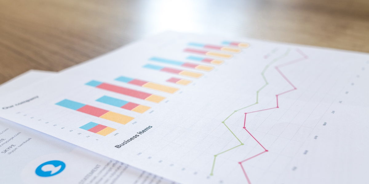 documents on a table to help grant managers understand the difference between ARPA and traditional funding