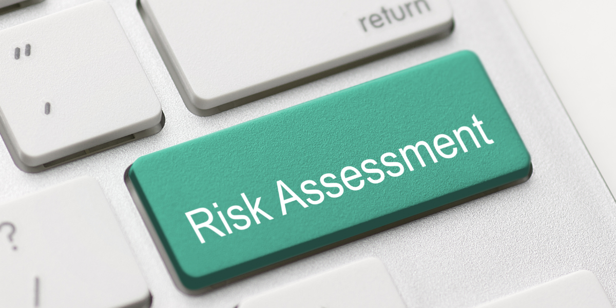 Risk assessment key on a keyboard to help grant managers assess risk with grant management software