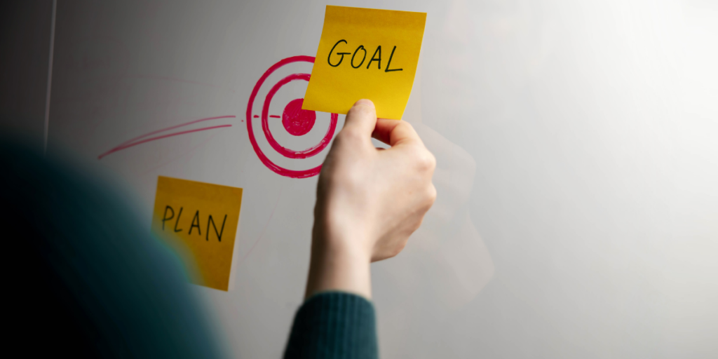 Post it note of goal for grant management