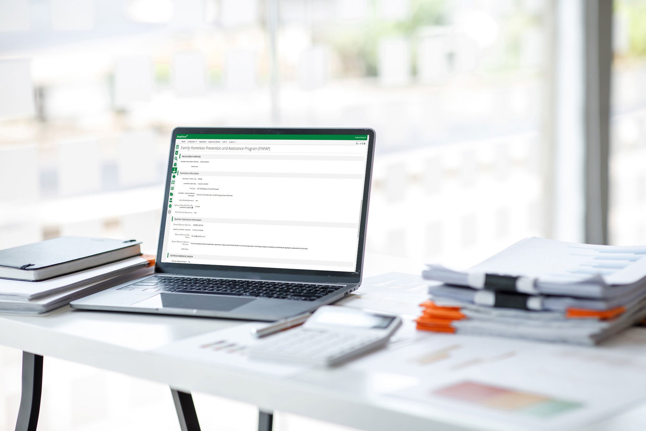 laptop showing AmpliFund app